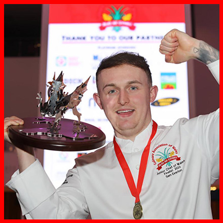 Sam Everton pictured holding a dragon trophy